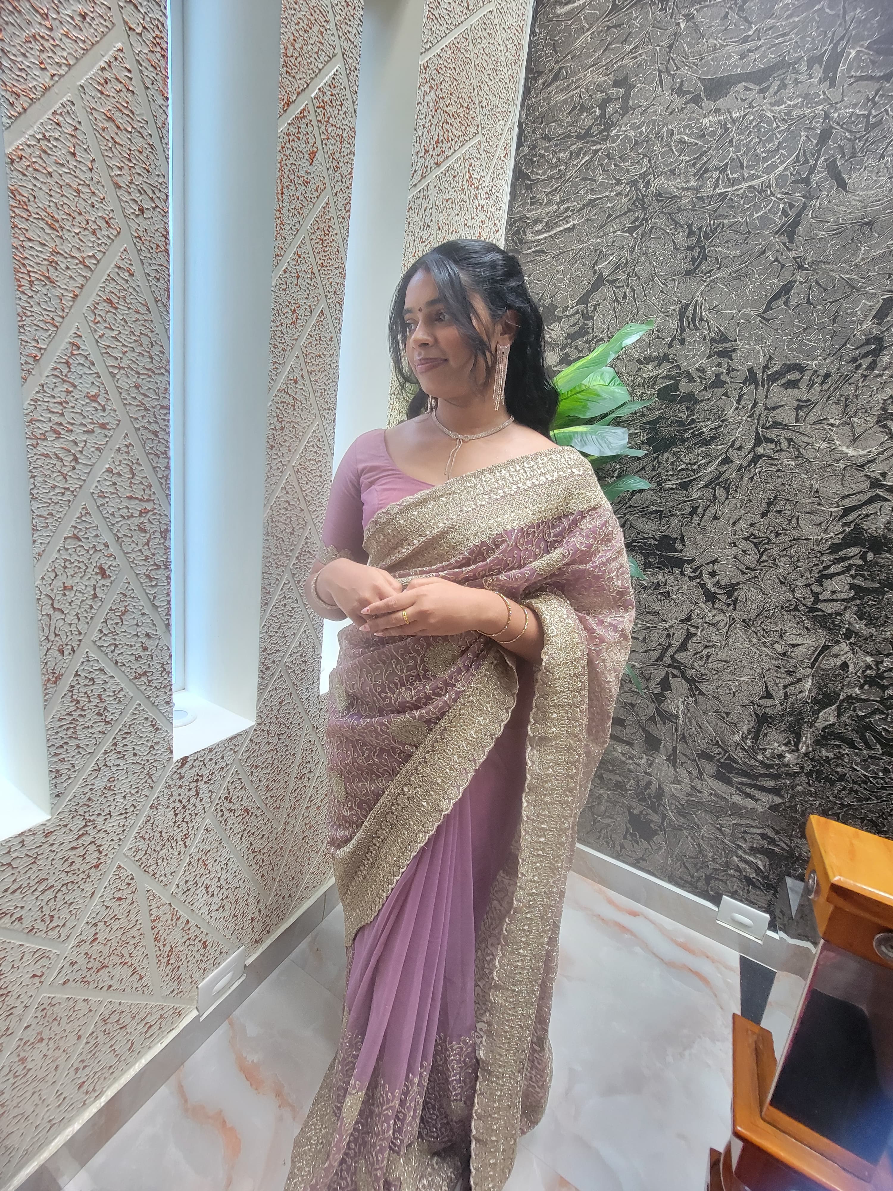 Woman in an elegantly draped saree