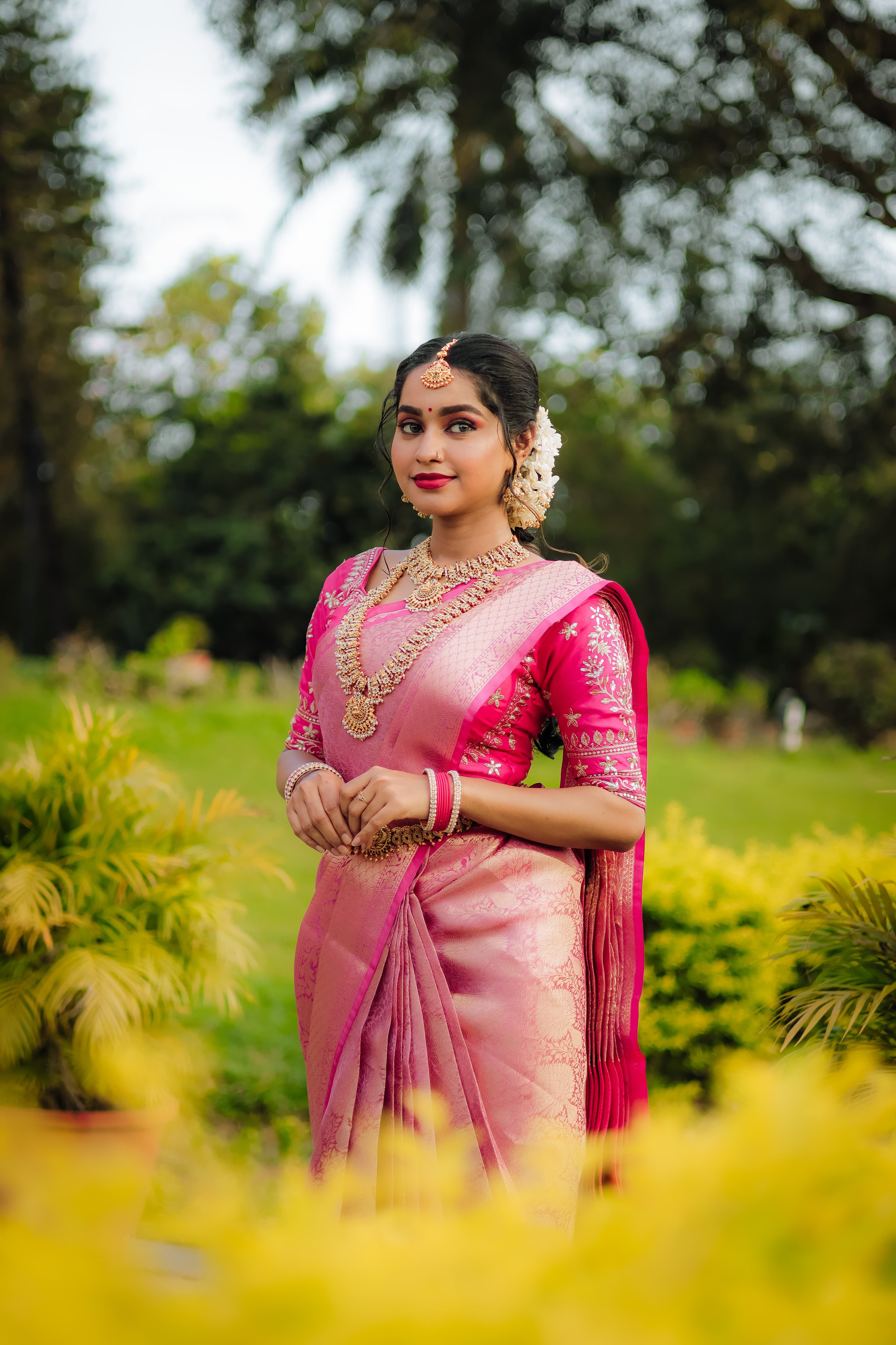Bride showing her full wedding attire